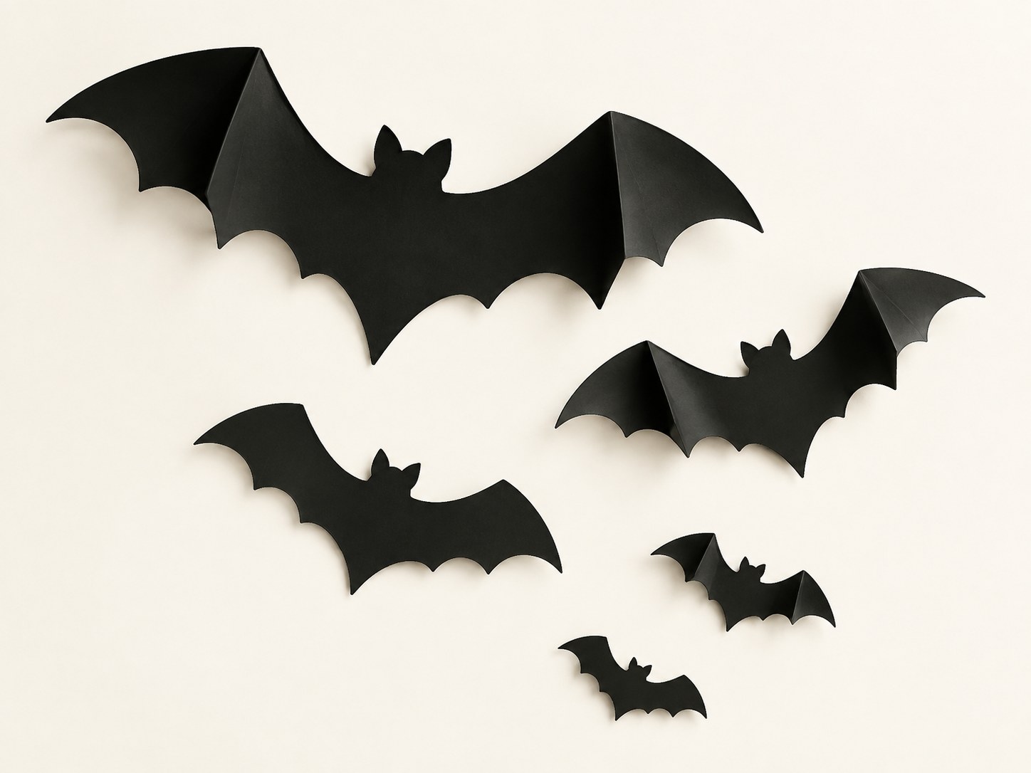 Illustration of five black dimensional bat silhouettes; see Amazon for the actual Piteno set